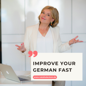 Natalie Deckers sitting on her desk, title: improve your German fast